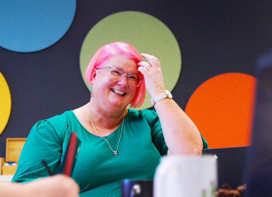 colourful laughing woman in meeting