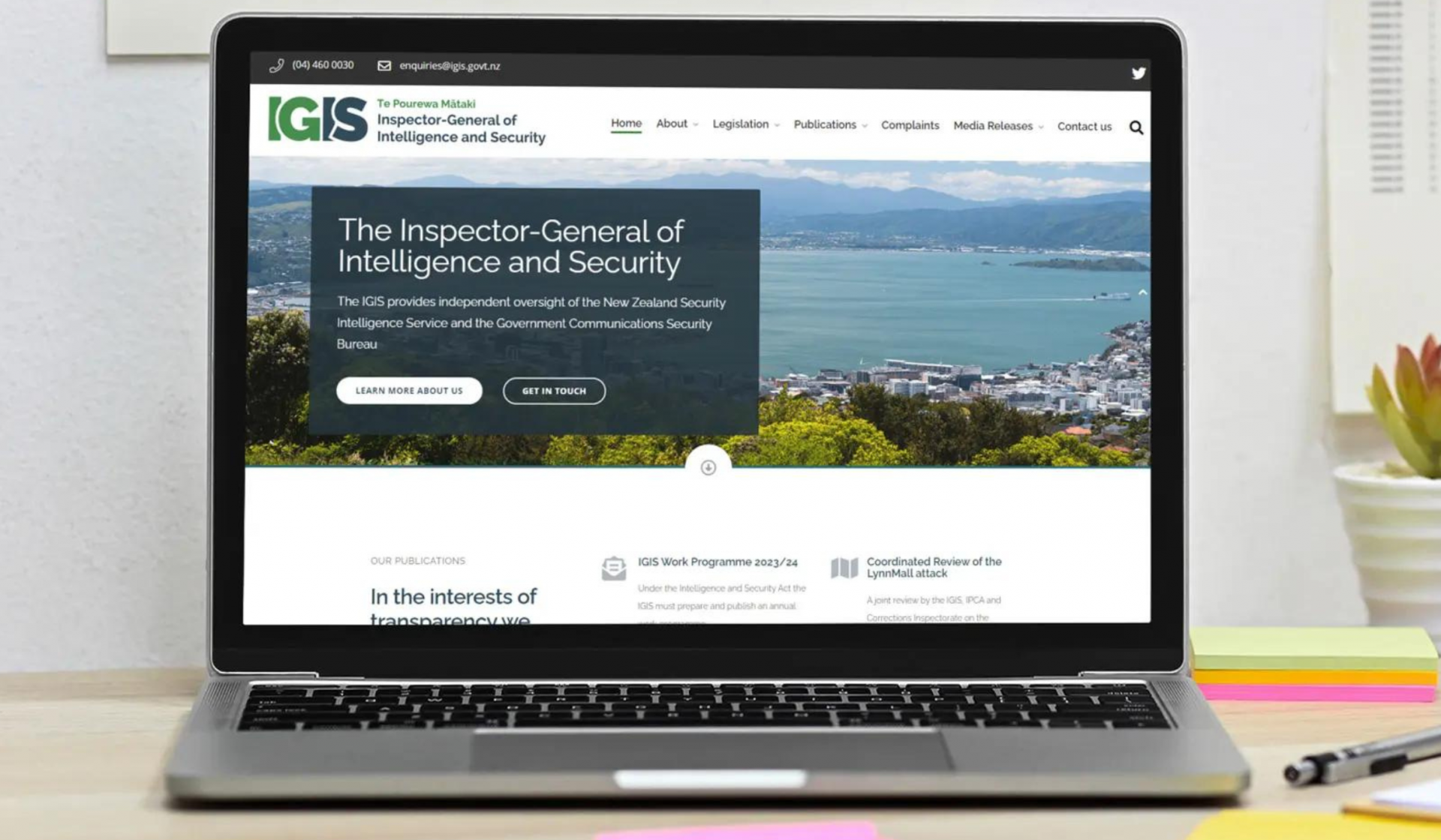 Laptop open on the IGIS Inspector General of Intelligence and Security homepage with the options to learn more or get in touch